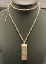 A Sterling Silver .925 Silver Jubilee (Elizabeth II) ingot pendant and a Sterling Silver .