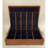 Oak thirty compartment lined case with brass handles,