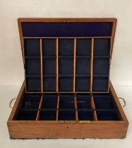 Oak thirty compartment lined case with brass handles,