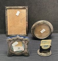 Three assorted size silver picture frames and a silver calendar with date cards (dated 1913)