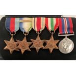 Set of five World War II medals and ribbons including 1939-1945 The Star, The Atlantic Star,