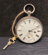 A Silver pocket watch in working order, complete with key.