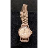 9ct gold "Omega" "Ladymatic" wrist watch with a 9ct gold chain link strap, 1960s.