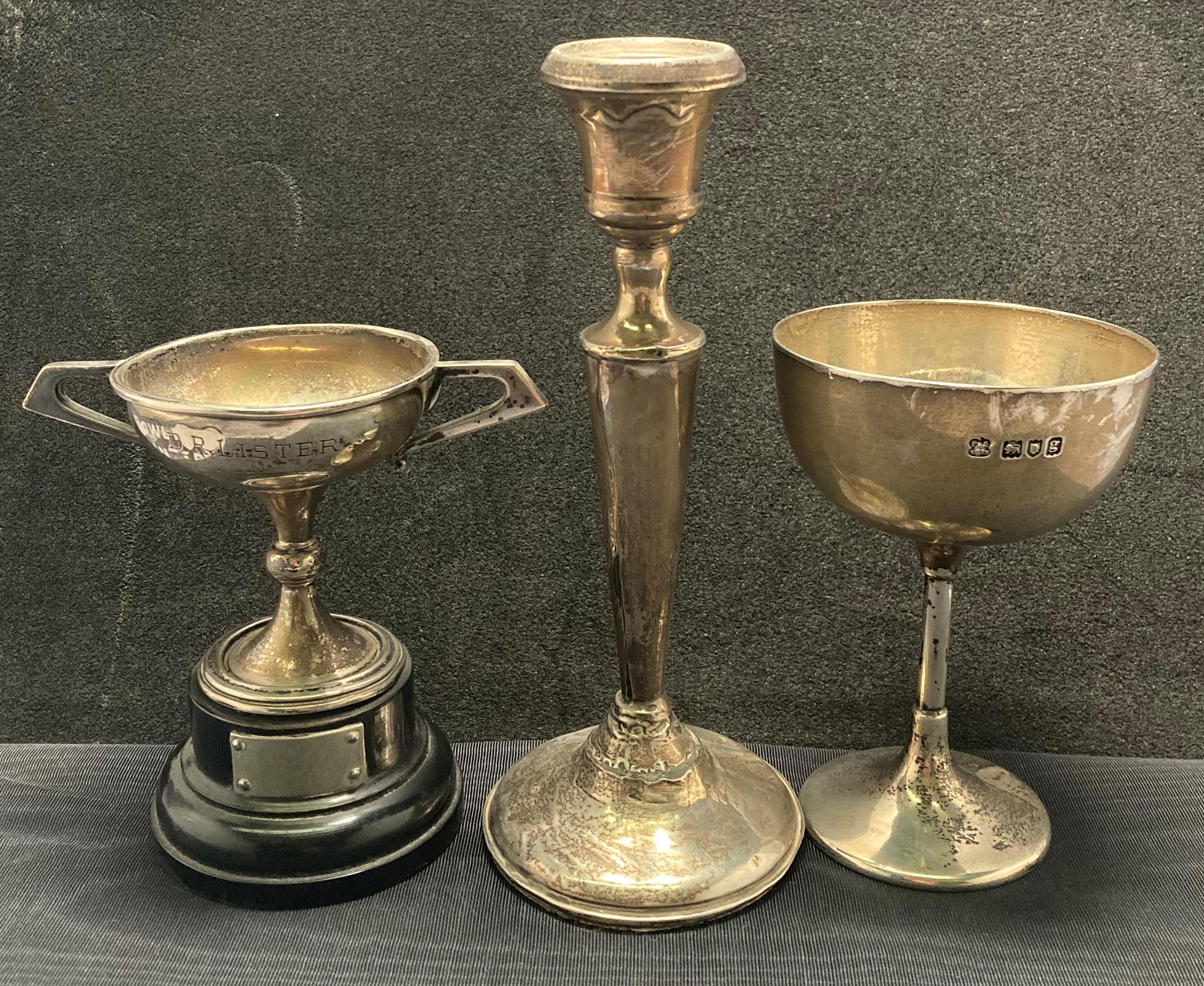 Two silver [hallmarked] trophies (1902 & 1923) and silver [hallmarked] candle stick holder with