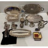 Thirteen silver-plate and metal items including, trays, candle stick holders,