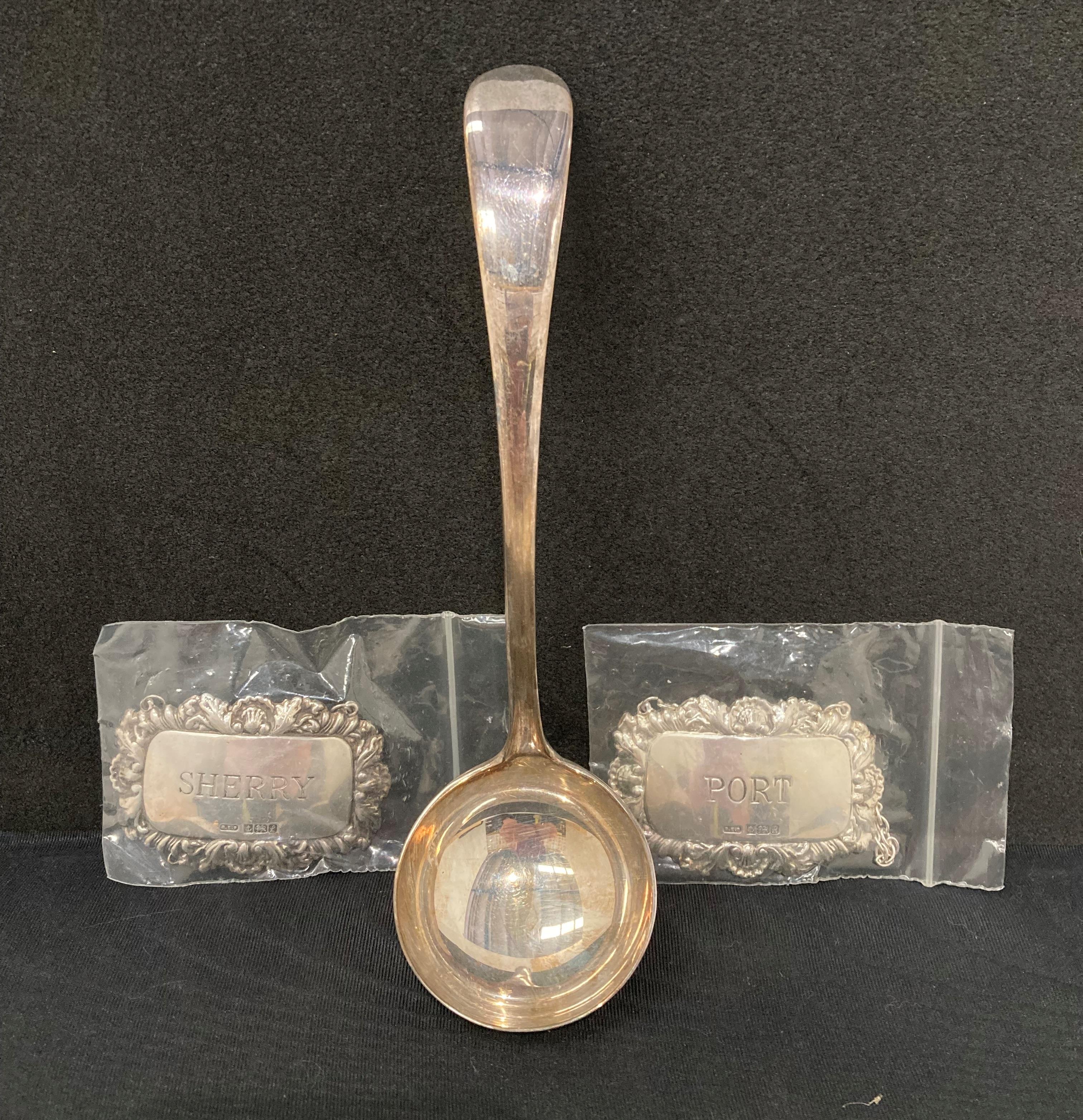 Silver [hallmarked] soup ladle, 1940, and silver [hallmarked] Port and Sherry decanter labels,1985,