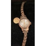 9ct gold Record Geneve ladies' gold wrist watch with a 9ct gold strap and a 18ct gold small St