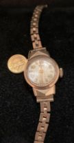 9ct gold Record Geneve ladies' gold wrist watch with a 9ct gold strap and a 18ct gold small St