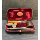 Loewe & Co London smokers' pipe with amber mouth piece (damaged) and silver collar,