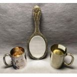 Three assorted silver/silver plated items including hand held mirror with scroll leaf design,