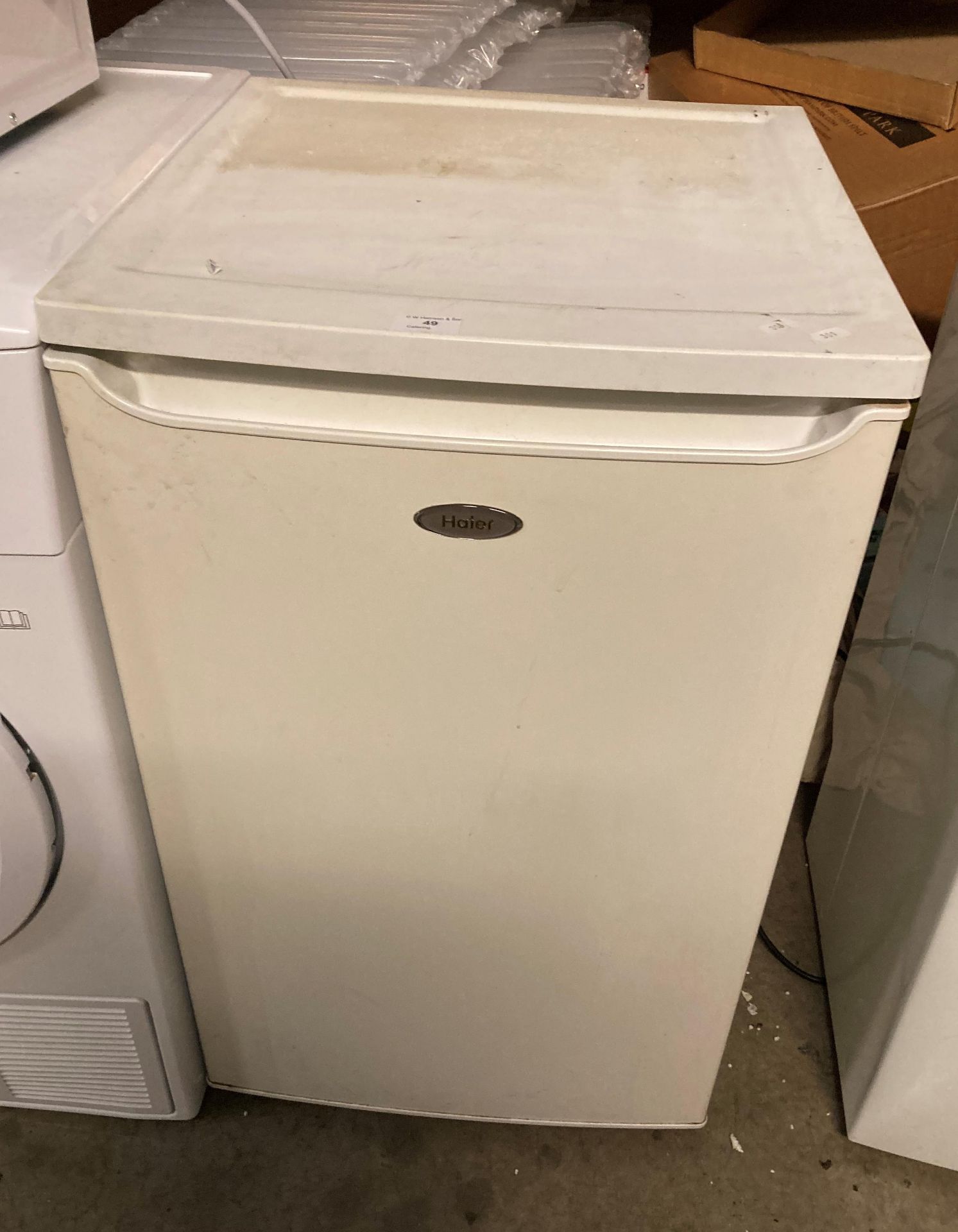 A Haier under counter fridge (one drawer missing)(saleroom location PO)