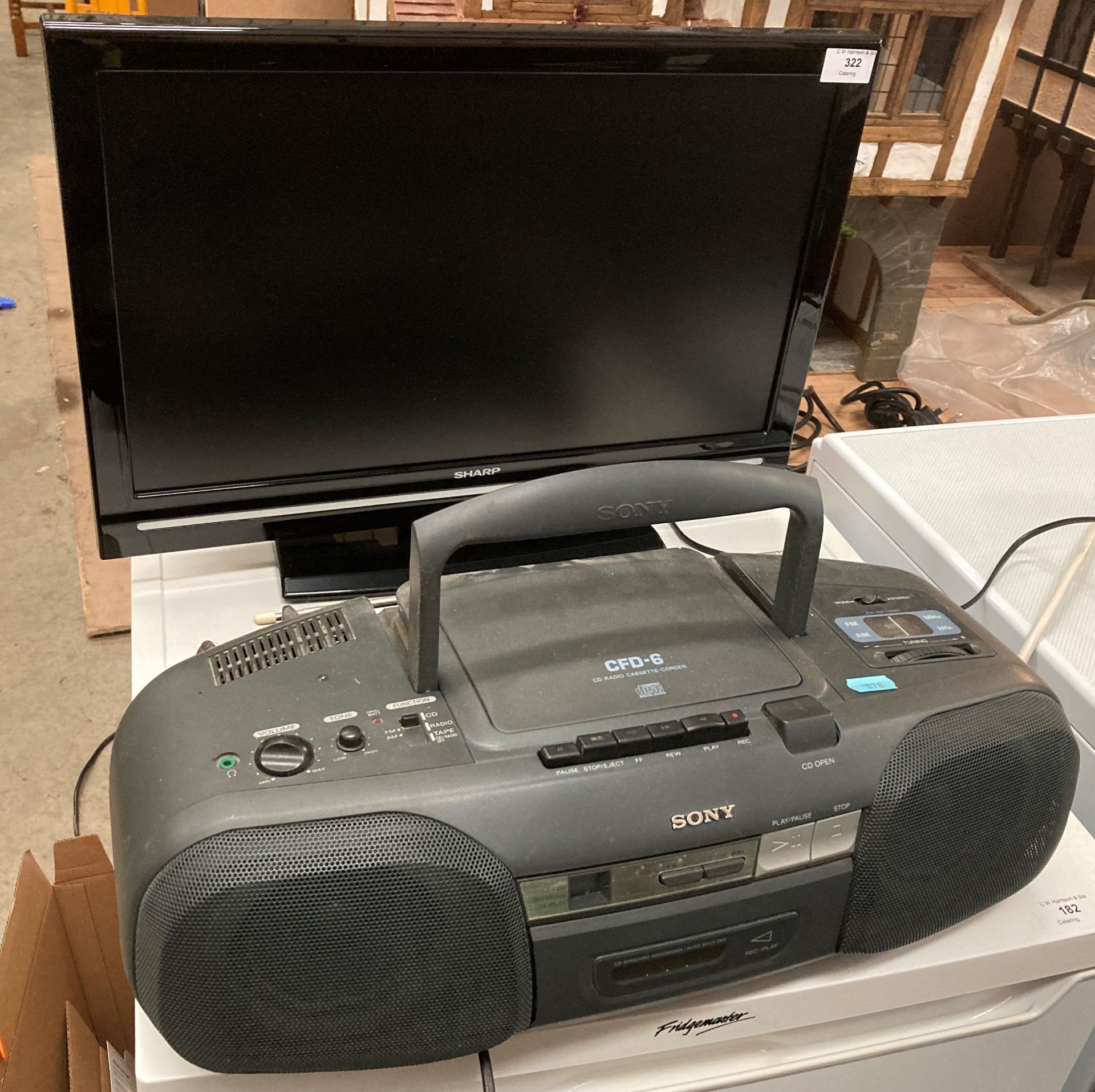 Sharp 20" LCD TV model LC-22D12E (no remote) and a Sony CFD-6 CD radio cassette-corder (saleroom
