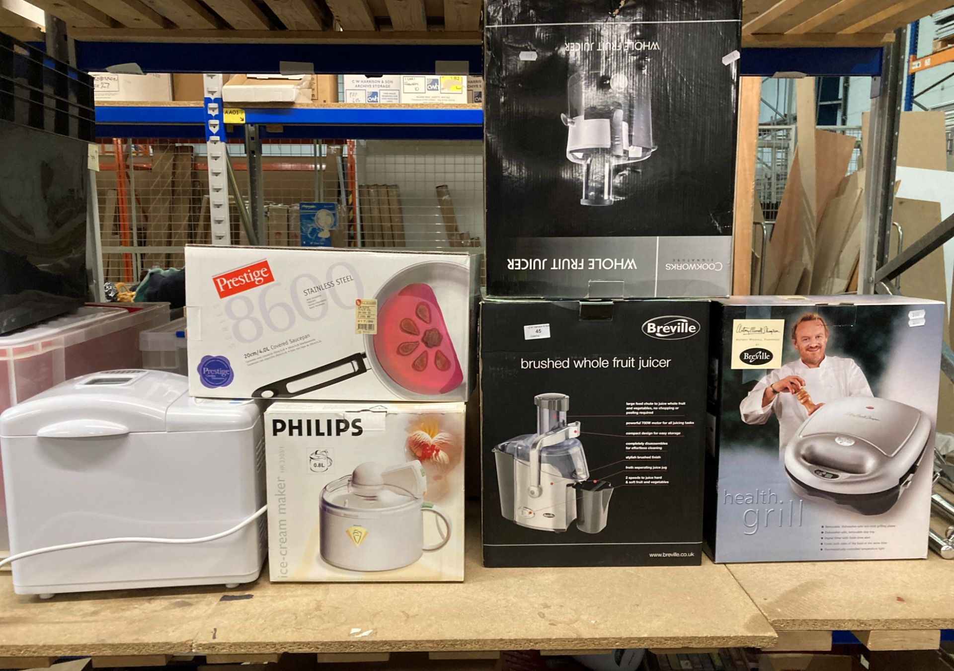 Two whole fruit juicers by Breville and Cookworks, Breville health grill, Phillips ice cream maker,