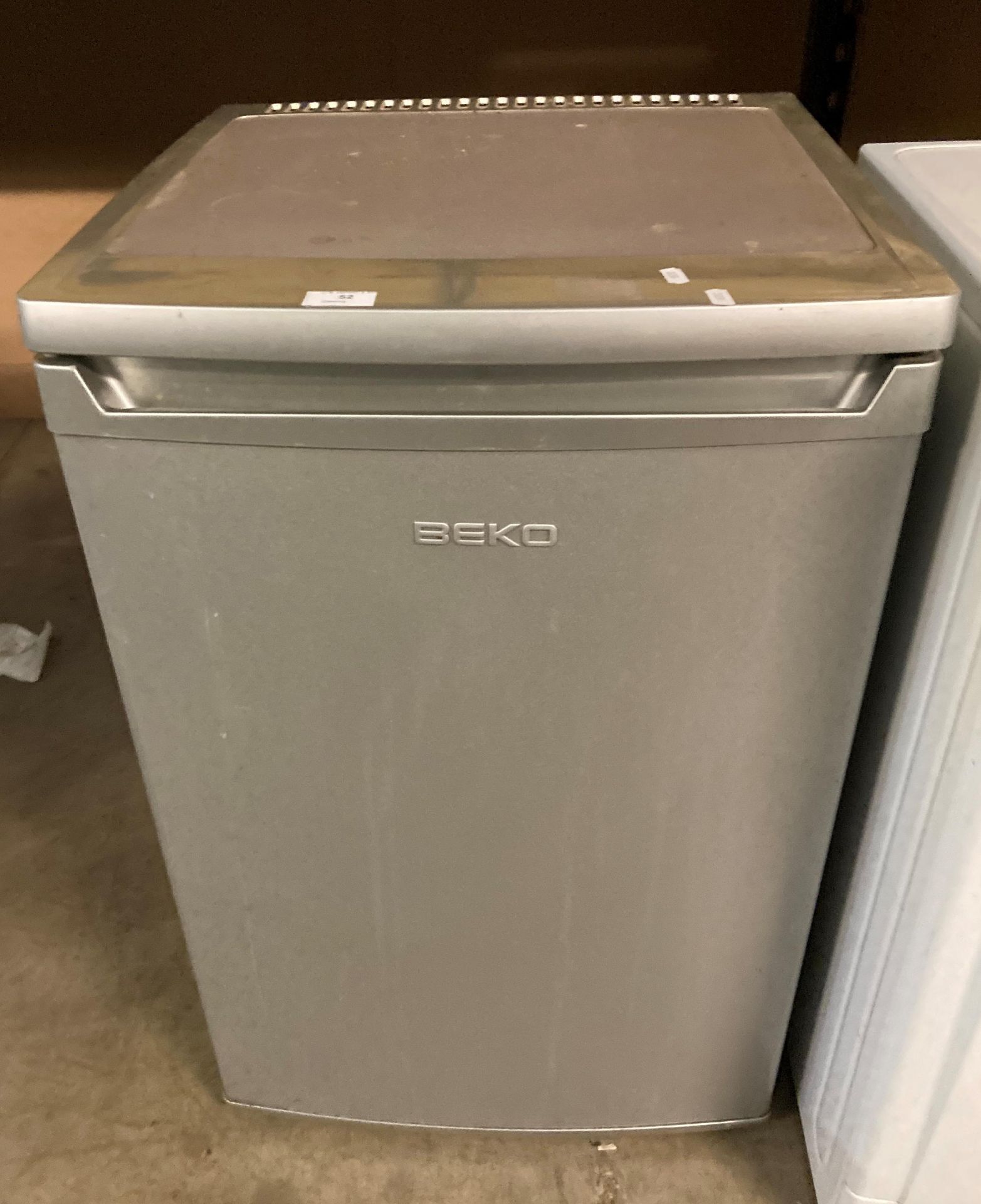 A Beko under counter fridge (saleroom location PO)