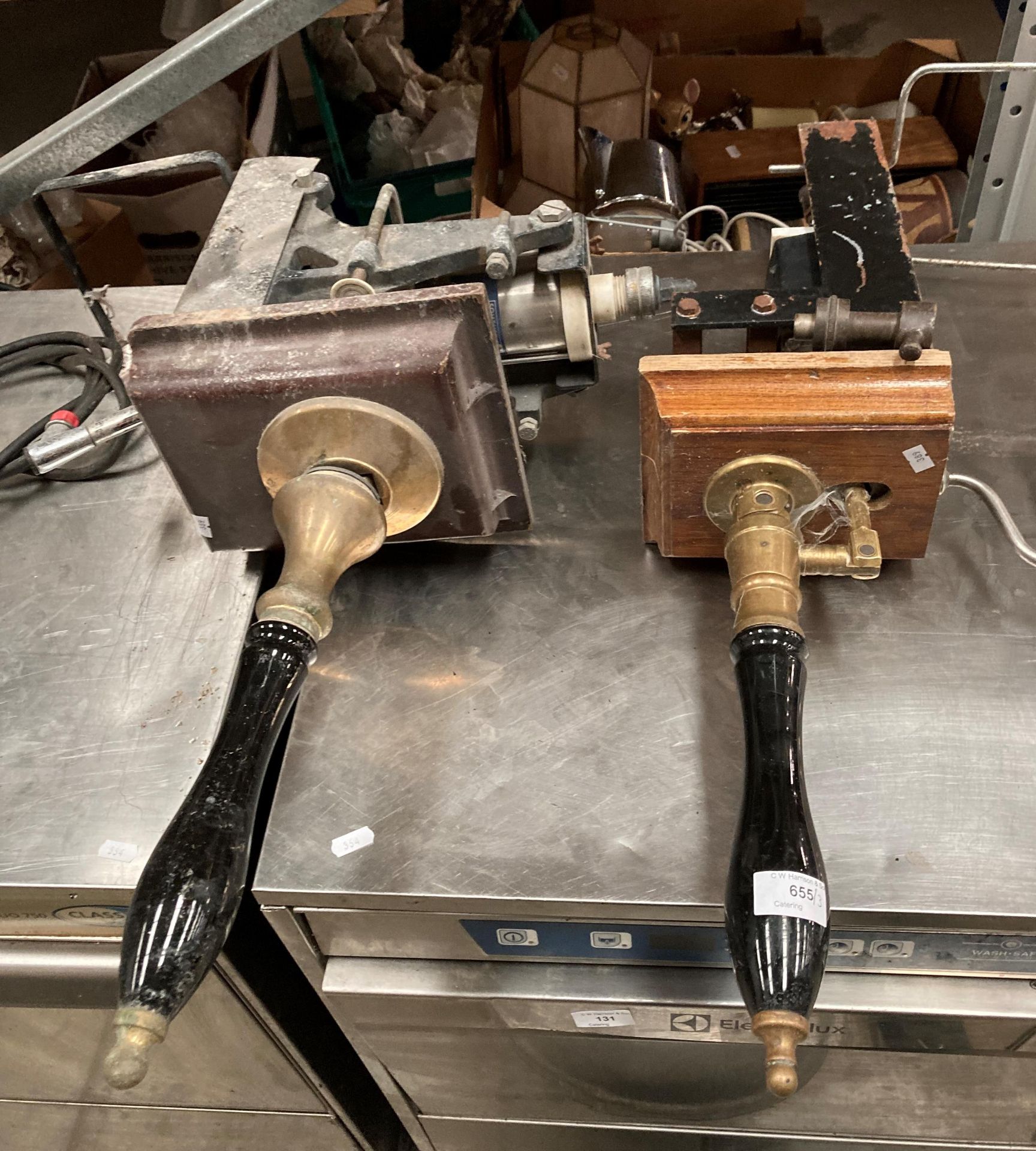 Two hand beer pumps and a keg containing out of date beer/lager - stamped "property of Mansfield