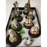 Black lid containing nine Country Artists cats 3 to 9cm high (saleroom location: X11)