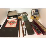 Box containing twelve plus games and toys including Monopoly, darts, brass topped Cribbage board,