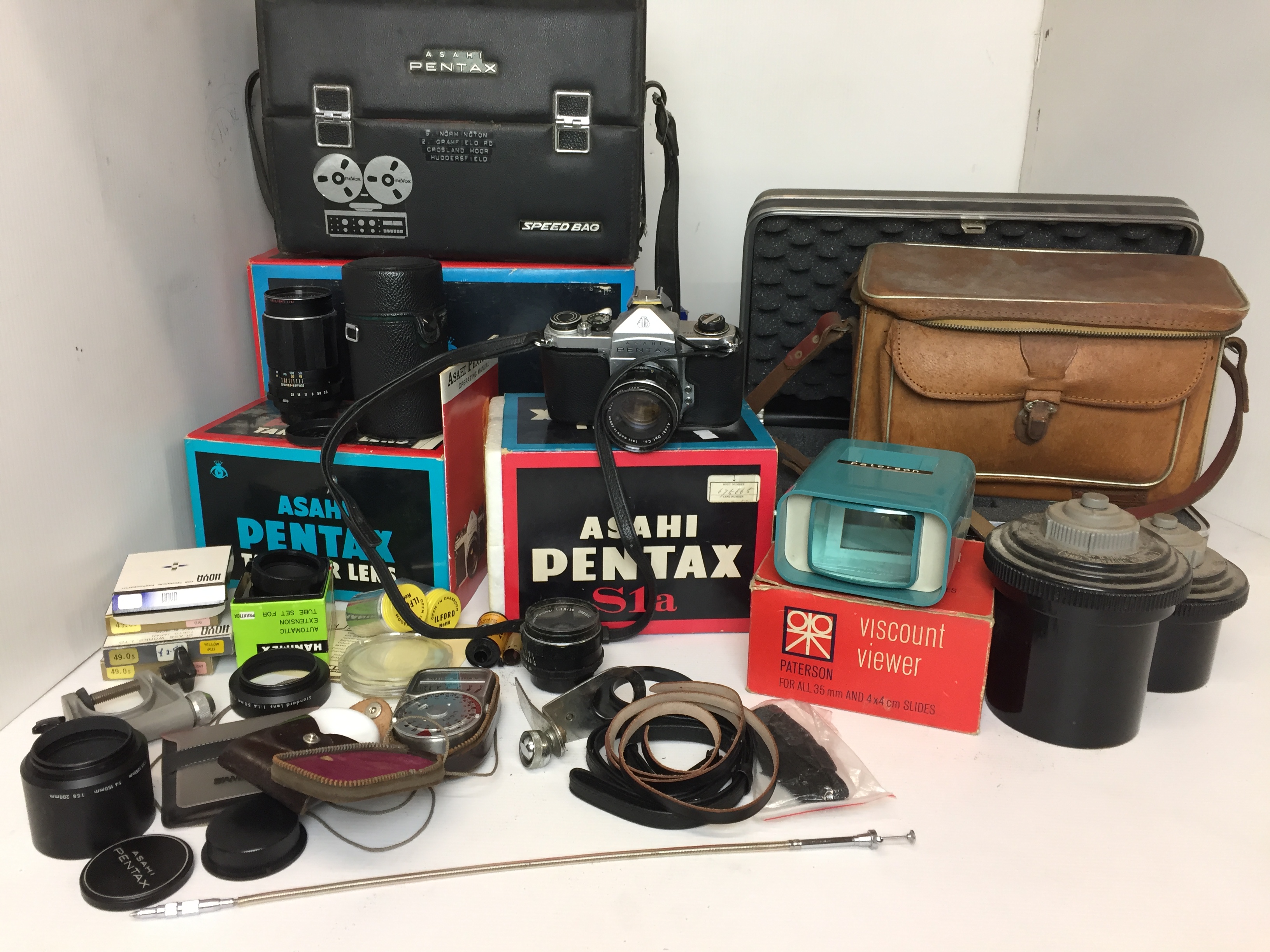 Twenty pieces of photographic equipment including Pentax S1a camera fitted with Asahi 1:2/5 5 lens