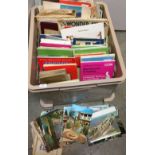 Plastic box containing postcards, maps, tourist guides,