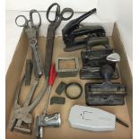 Ten plus items including vintage staplers and hole punches, pinking shears,