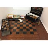 Wooden chess board, chess pieces, draughts,