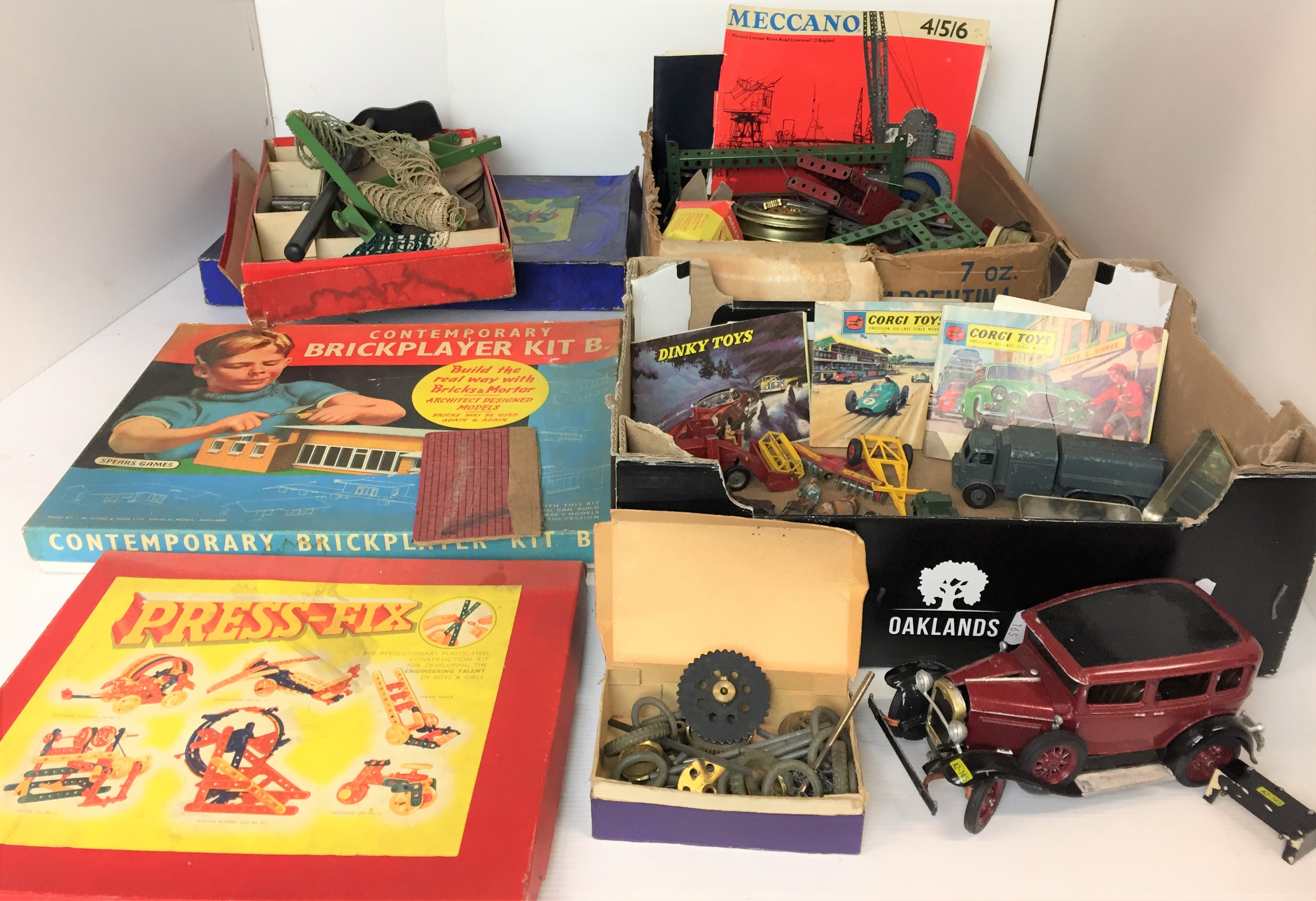 Two boxes containing diecast vehicles, Meccano, Press-Fix, table tennis games, metal farm animals,