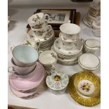 Contents to part of rack - a Paragon yellow pattern cup and saucer,