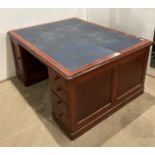 Large mahogany double-sided kneehole desk with blue leather top,