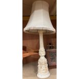 A composite table lamp decorated with putti complete with shade,