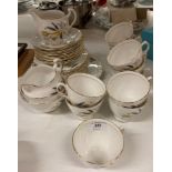 Thirty-six pieces of Colclough bone chine yellow leaf pattern tea service(saleroom location: Y07)