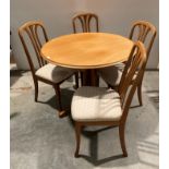 Sutcliffe of Todmorden light teak circular-to-oval extending dining table and four matching chairs,