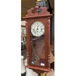 A Hermele wall clock in oak finish case, 70cm,