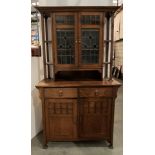 Oak Arts & Crafts style four-door two-drawer sideboard with a two-door two-drawer base section and