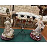 Two composite lady figurine table lamps and a metal four-piece candlestick (3) (saleroom location: