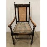 Barley twist oak framed armchair with cane back and floral engraved top with small scroll-finished