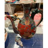 An oriental patterned jug with stopper,