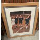 A framed photo print of the coin toss up for the 1972 FA Cup Final featuring Leeds United and