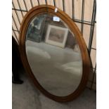 A mahogany framed oval wall mirror,