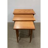 Teak finish nest of three tables on round tapered legs (saleroom location: MA7)