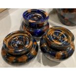Three assorted size blue and brown glazed tobacco jars/storage jars with lids (saleroom location: