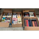 Four boxes of various hard and paperback novels and other books - authors including Wilbur Smith,