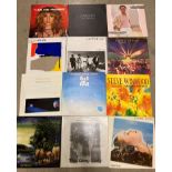 Twelve assorted 12" vinyl records including Eagles, Genesis, Supertramp, Fleetwood Mac,