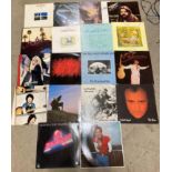 Eighteen assorted 12" vinyl records including Housemartins, Phil Collins, Genesis, Chris Rea,