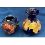 Moorcroft small vase with floral design 13cm high and a Moorcroft jar (missing lid and chip to rim)