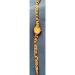 9ct gold [stamped: 375] ladies Rotary wrist watch with a 9ct gold [stamped 375] strap.