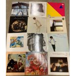 Twelve assorted 12" vinyl records including Kate Bush, Jaime Taylor, Dire Straits, Joni Mitchell,