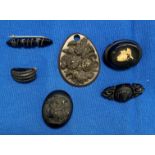 Six pieces of Victorian mourning jewellery including brooches, locket,