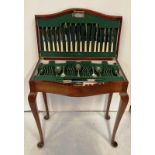 Sixty-five piece silver plated canteen of cutlery in a mahogany case on cabriole legs by W