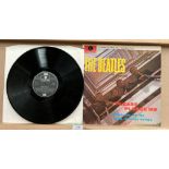 The Beatles LP 'Please Please Me' on Parlophone EMI Records PCS3042 (saleroom location: S3 behind