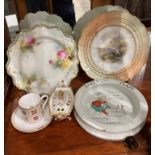 Two assorted Royal Worcester plates, one with a mountain scene and the other with rose design,